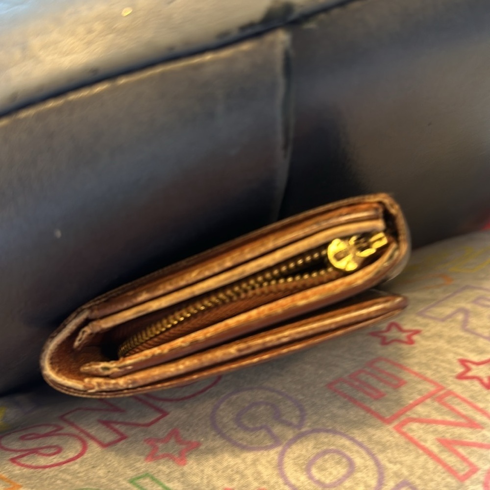 Louis Vuitton billfold. The dimensions are 6 inches wide and 4 inches. Authentic - Picture 9 of 10